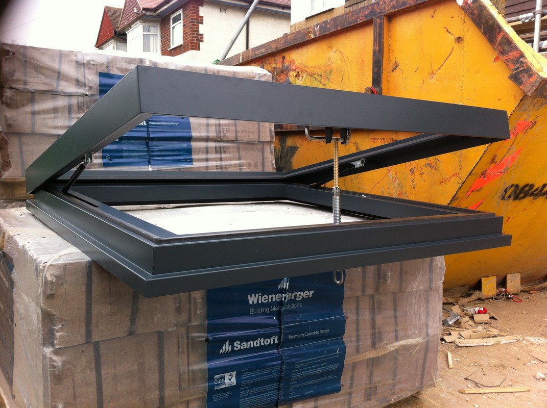 Opening flat roof skylight in anthracite grey installed in Tooting
